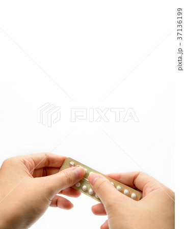 Woman hand taking birth control pills. Asian adult 37136199
