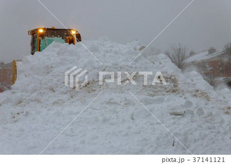 Tractor vehicle cleaning from the snow storm Tractor vehicle cleaning from the snow storm 37141121