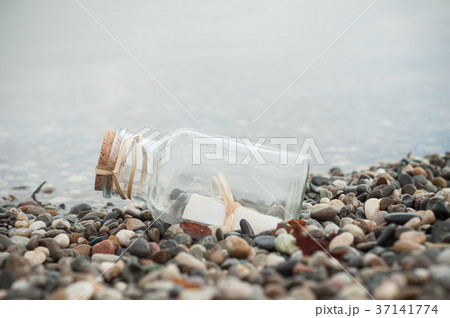 closeup of message in a bottle on the beach closeup of message in a bottle on the beach 37141774