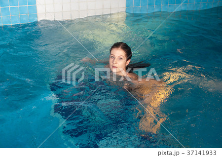 Attractive girl in swimming pool 37141933