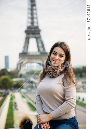 Beautiful girl posing to the photographer against Beautiful girl posing to the photographer against 37142615