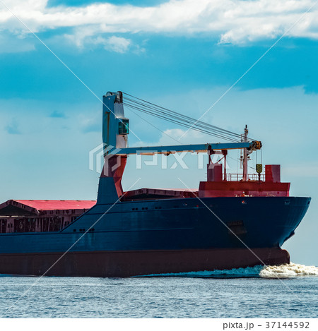 Blue cargo ship underway Blue cargo ship underway 37144592