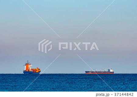 Blue container ship underway 37144842