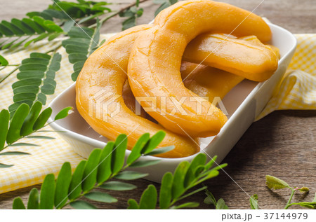 Pickled Tamarind Fruit on wooden background. 37144979