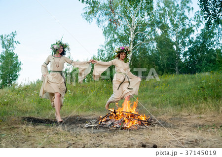 Attractive girls jump through fire 37145019