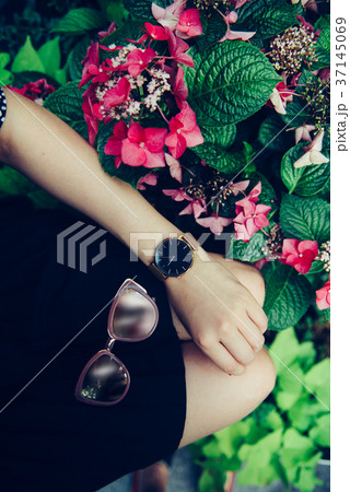 Female accessories concept Sunglasses golden watch Female accessories concept Sunglasses golden watch 37145069