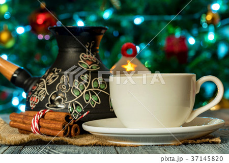 Cozy winter setting with cup of coffee and cezva 37145820