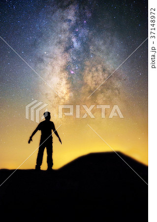 Milky way and human in silhouette 37148972