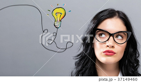 Light Bulb with young businesswoman Light Bulb with young businesswoman 37149460