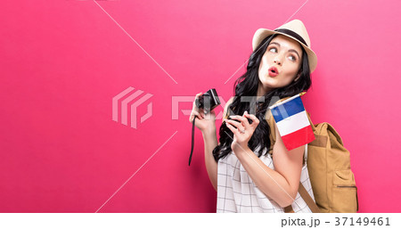 Traveling young woman holding a camera with Traveling young woman holding a camera with 37149461