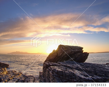 Stony beach and cliff of rocky bay. Blue tones 37154333