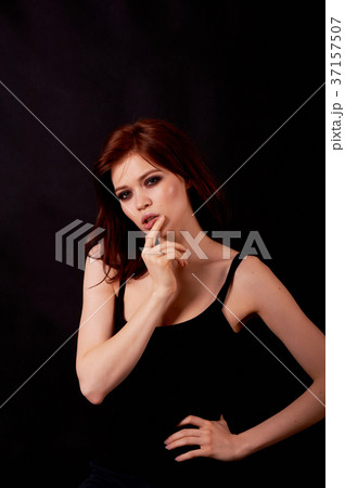 Girl in Studio on a black background.Red hair 37157507