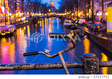 Night illumination of Amsterdam canal and bridge 37157752