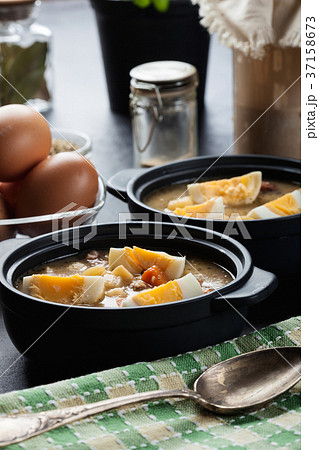 The sour soup made of rye flour with eggs 37158673