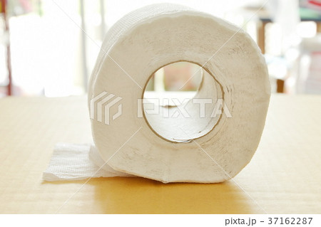 white tissue paper rolling on brown hard board 37162287