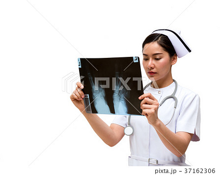 Young Asian nurse look at x-ray film Young Asian nurse look at x-ray film 37162306