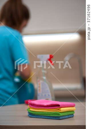 Blurred image of Charming woman doing cleaning Blurred image of Charming woman doing cleaning 37162496