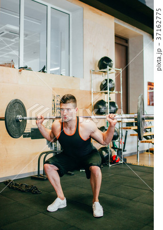 Hard gym workout body-building man concept. Hard gym workout body-building man concept. 37162775