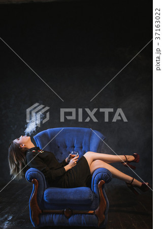 successful woman enjoying life smoking drink 37163022