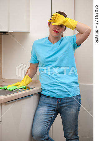 Portrait of tired housewife after cleaning Portrait of tired housewife after cleaning 37163085