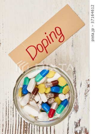 Glass jar of banned drugs 37164612