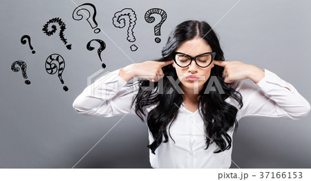 Question Marks with oung woman blocking her ears 37166153