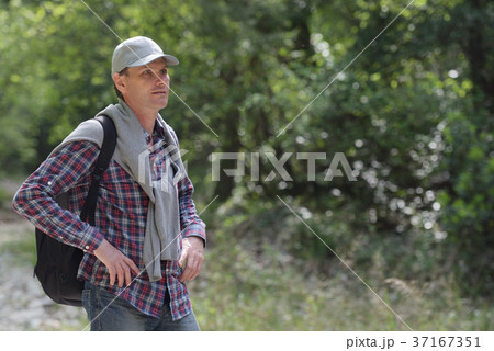 Man with backpack outdoors 37167351