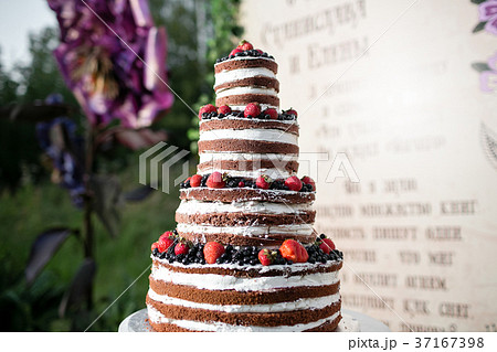 Round multi tiered wedding cake with sponge, cream 37167398