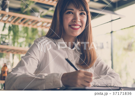 start up woman work in cafe. female student write note in notebook in coffee shop. education, lifestyle, business, people concept. 37171836