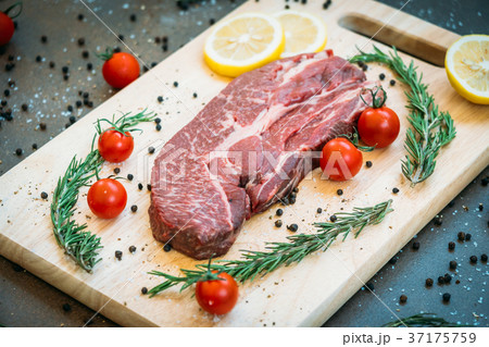 Raw beef meat on cutting board 37175759