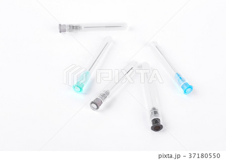 Medical syringe needles, white background. Medical syringe needles, white background. 37180550