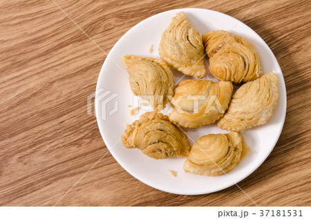 Curry puff snacks on white dish with wood 37181531