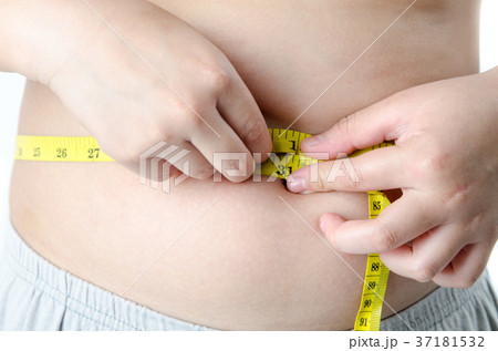 The boy with his belly with a tape measure 37181532
