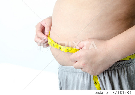 The boy with his belly with a tape measure The boy with his belly with a tape measure 37181534