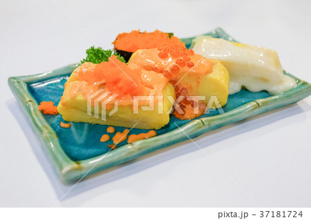 Japanese rolled eggs on white table. Japanese rolled eggs on white table. 37181724