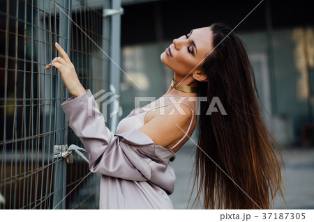 Fashion portrait of a sexy girl in a coat and Fashion portrait of a sexy girl in a coat and 37187305