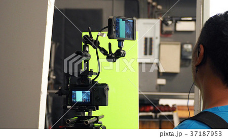 Behind video camera and green screen Behind video camera and green screen 37187953