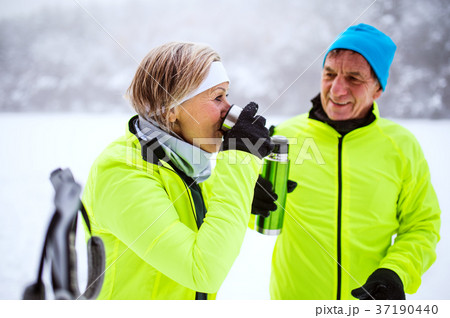 Senior couple cross-country skiing. 37190440