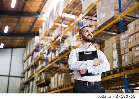 Portrait of a male warehouse worker or supervisor. Portrait of a male warehouse worker or supervisor. 37190759