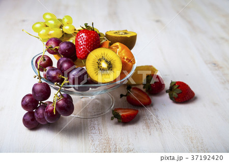 Ripe fruits on a transparent plate 37192420