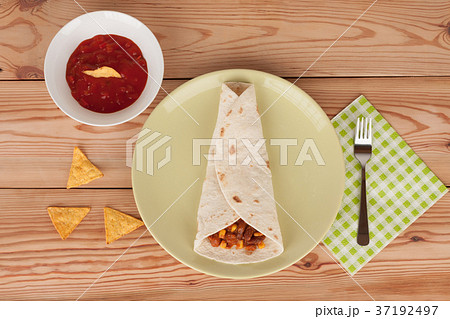 Chili Con Carne on tortilla wrap with salsa sauce  37192497