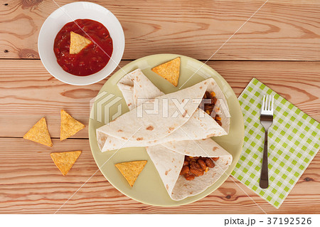 Chili Con Carne on tortilla wrap with salsa sauce Chili Con Carne on tortilla wrap with salsa sauce 37192526