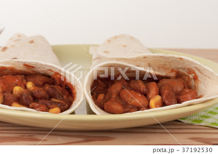 Chili Con Carne on tortilla wrap with salsa sauce Chili Con Carne on tortilla wrap with salsa sauce 37192530