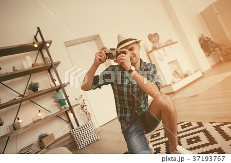 Man take a photo of pregnant woman in loft Man take a photo of pregnant woman in loft 37193767