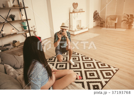 Man take a photo of pregnant woman in loft Man take a photo of pregnant woman in loft 37193768