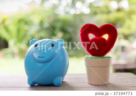 Piggy bank and red heart 37194771