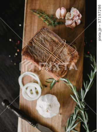 Chunk of salted smoked lard in gauze with a rope 37197286