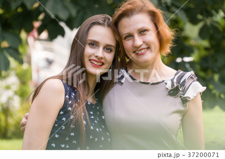 Closeup Portrait of Adult Daughter and Mother 37200071