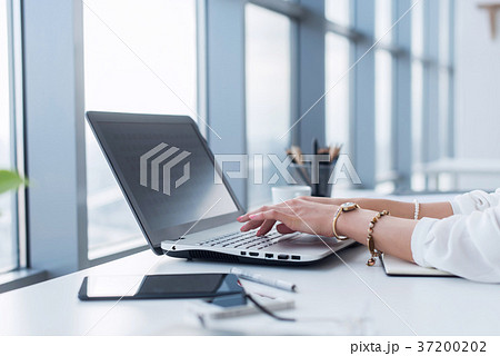 Female copywriter at her workplace, home, writing 37200202