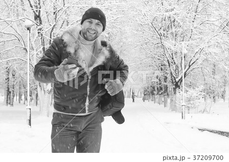 A man in winter clothes on the street A man in winter clothes on the street 37209700